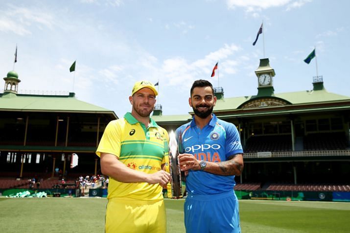 Aaron Finch and Virat Kohli posing with the Gillette ODI Trophy