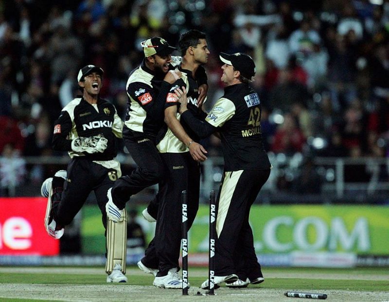 Mortaza being congratulated by his KKR teammates