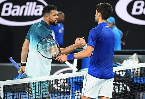 Tsonga (left) and Djokovic shake hands after the match