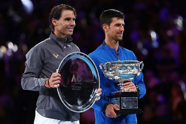 Djokovic (right) beat Nadal to lift the Australian Open trophy for a record 7th time