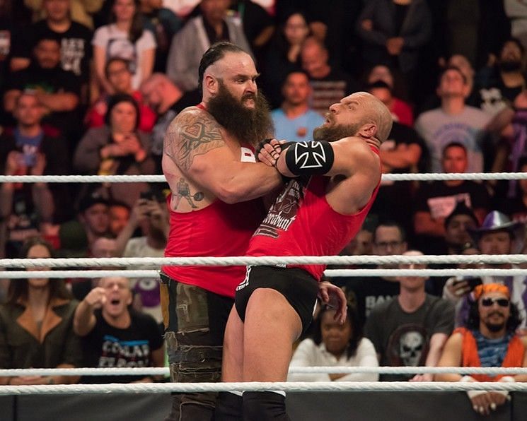 Strowman is shown choking Triple H at Survivor Series 2017