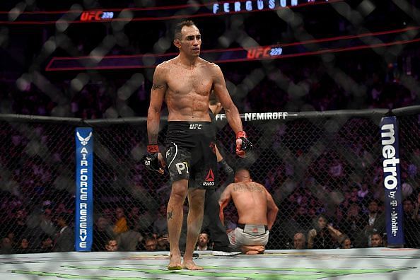 Tony Ferguson walks away from a downed Anthony Pettis at UFC 229