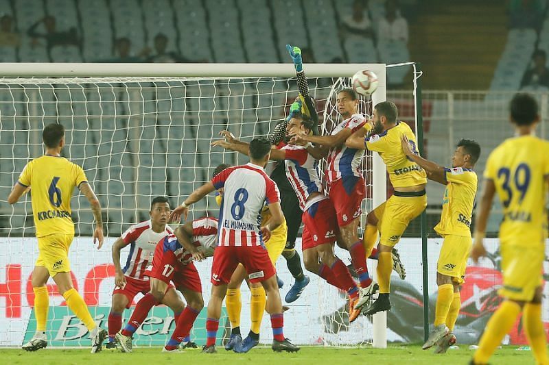 ATK and Kerala players wrestle for the ball