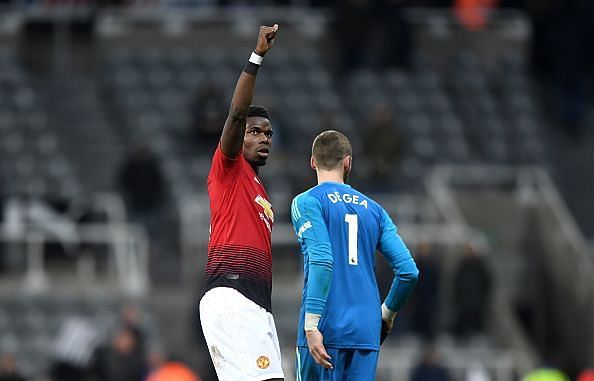 Paul Pogba salutes the fans after the away win at Newcastle