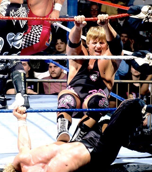 Owen Hart trying to eliminate a superstar in the 1996 Royal Rumble