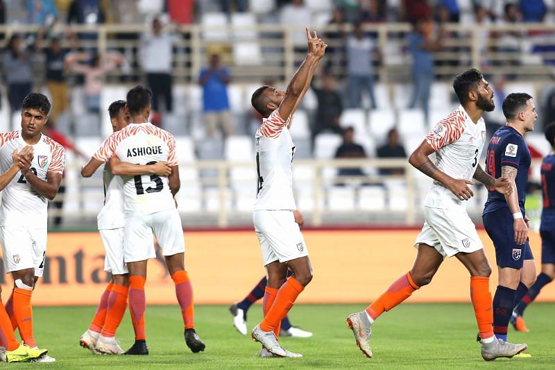 Indian players celebrate the first goal of the game.