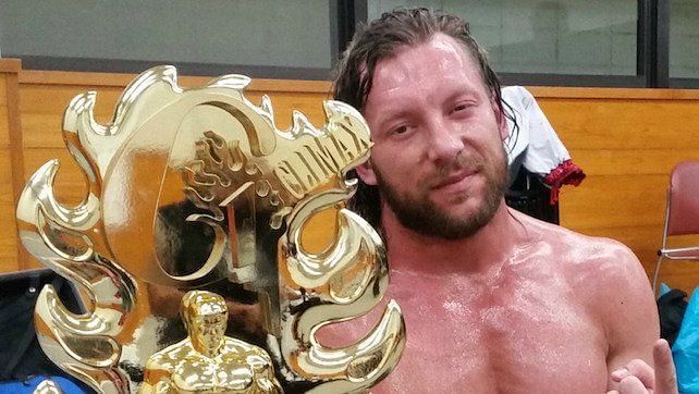 Kenny Omega poses with his Climax trophy.