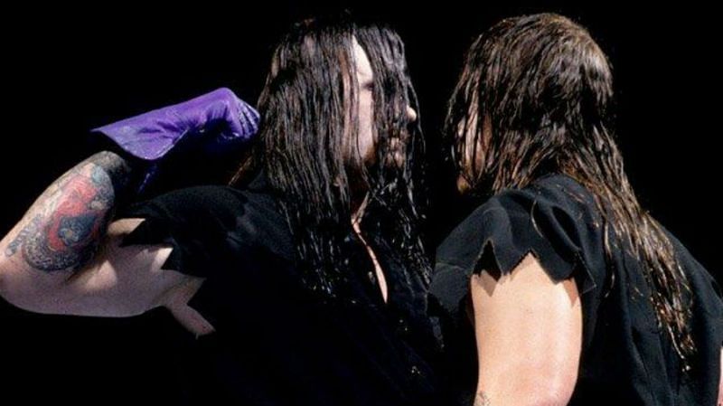The real Undertaker (left) stares down against his doppelganger.