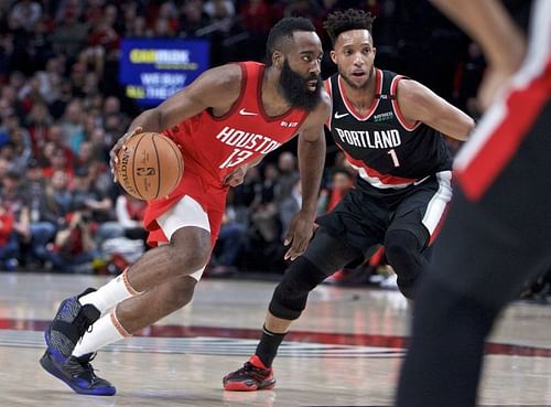 James Harden dribbling past the Portland Blazers on the way to make a three