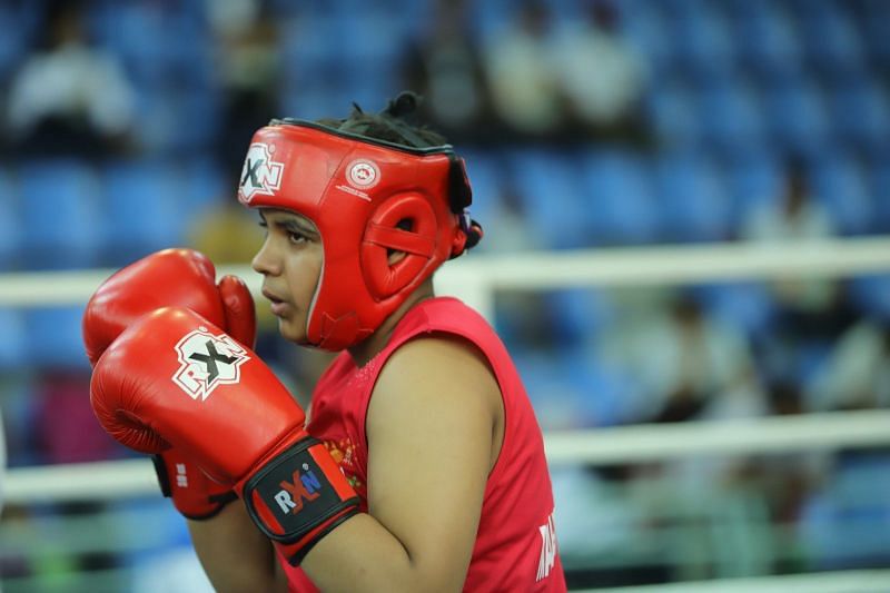 U-17 girls Welter (66kg) Gold medallist Mitika Gunele (Red) from Maharashtra in action 