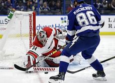 Point has 2 late goals, Lightning beat Hurricanes 3-1