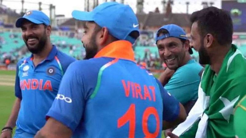 Indian and Pakistani senior players and staff share a laugh after the Champions Trophy final.