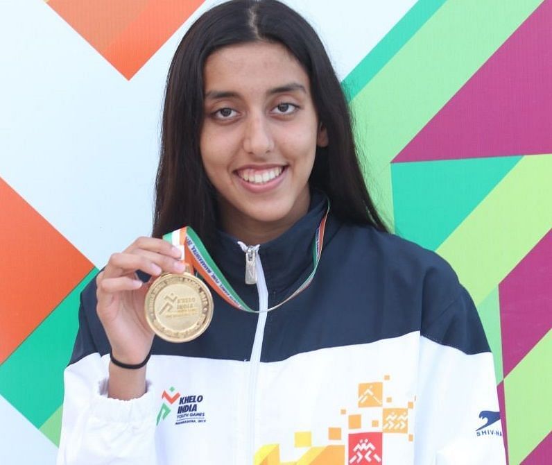 Kenisha Gupta from Maharashtra with her 50m freestyle gold medal in swimming 