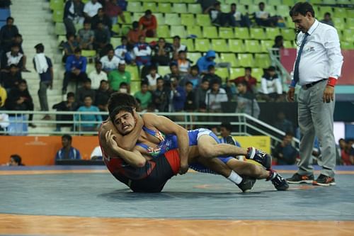 Wrestler Deepak Singh from J&K (in blue) in action against Maharashtra’s Parveen in the boys U-17 freestyle wrestling 55kg weight category at the Khelo India Youth Games