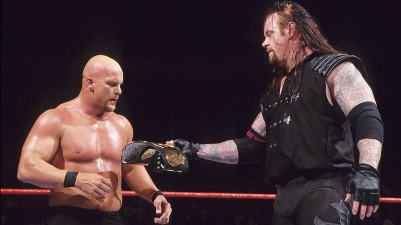The Deadman hands Stone Cold the WWF Championship after their Summerslam 1998 bout