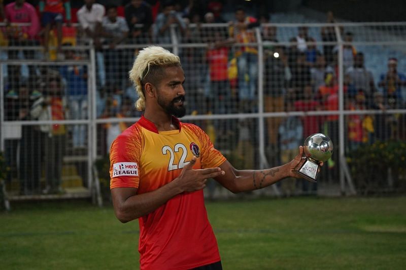 Justin with the man of the match trophy