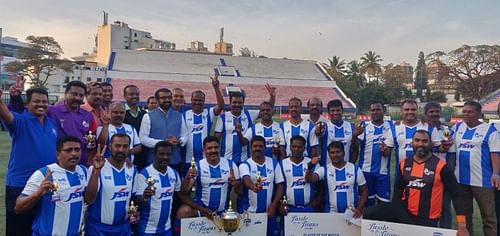 The ITI Legends' team celebrates after its win over HAL in an exhibition game at the Bangalore Football Stadium on Saturday