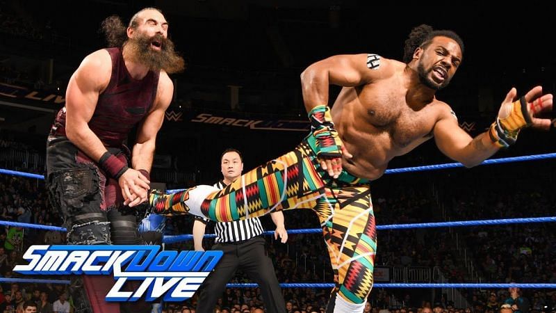 Xavier Woods lands a kick to Luke Harper&#039;s midsection.