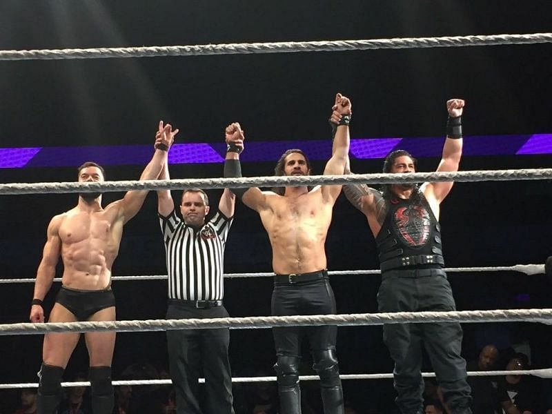 Finn Balor with Seth Rollins and Roman Reigns