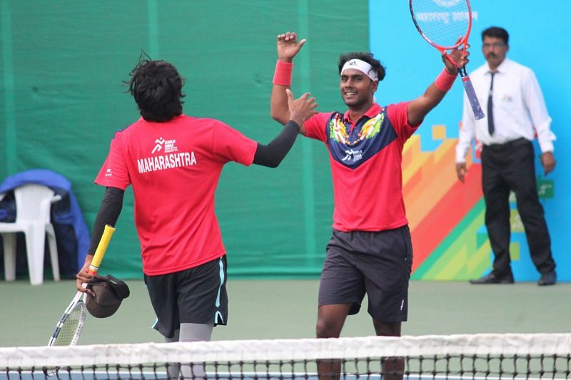 Armaan Bhatia and Dhruv Sunish (Mah), a gold medal winner in tennis boys U-21 doubles, in action at Khelo India Youth Games