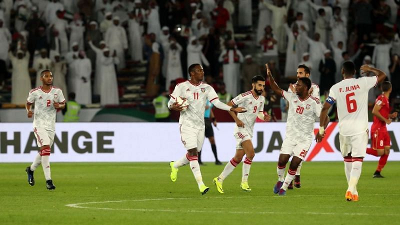 UAE players celebrate after scoring against Bahrain in the opening match