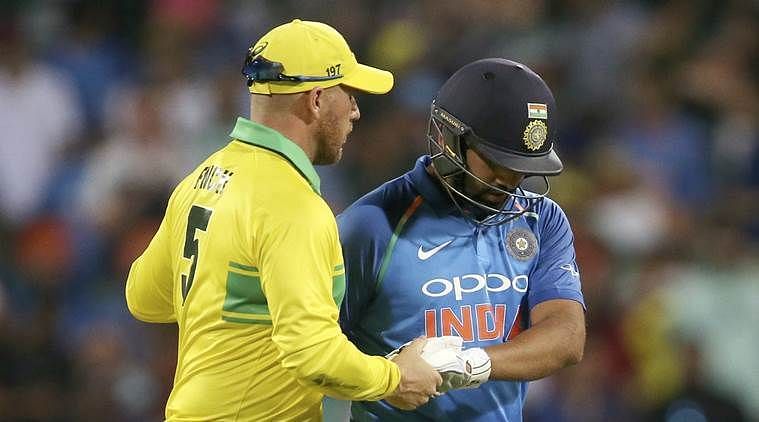Opponent Skipper Aaron Finch consoles Rohit Sharma after&Acirc;&nbsp;his wicket