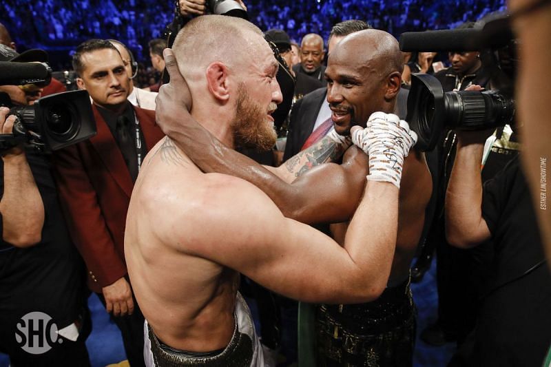 Conor McGregor and Floyd Mayweather share a moment after their match