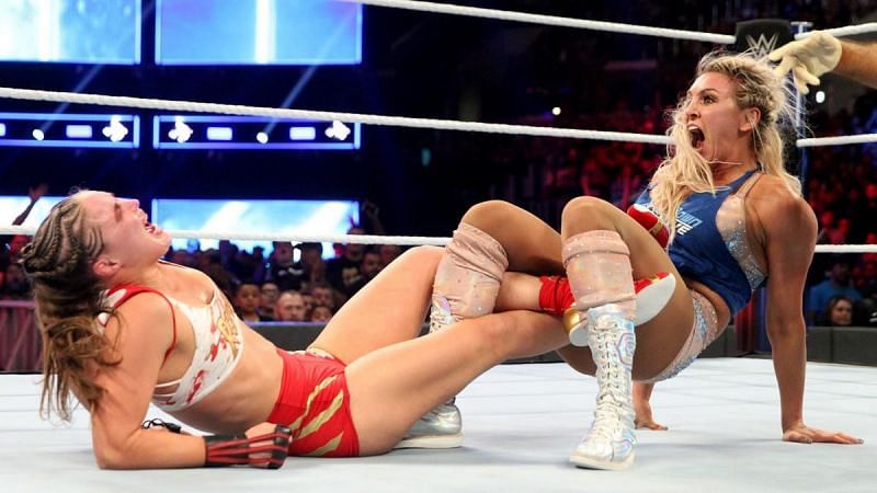 Charlotte Flair applying Ronda the figure 4 leg lock at Survivor Series