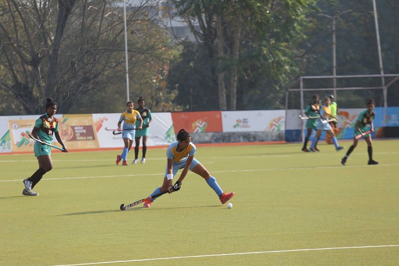 Haryana (in blue) in action against Jharkhand (in green) in the Girls&#039; U-21 Hockey Final