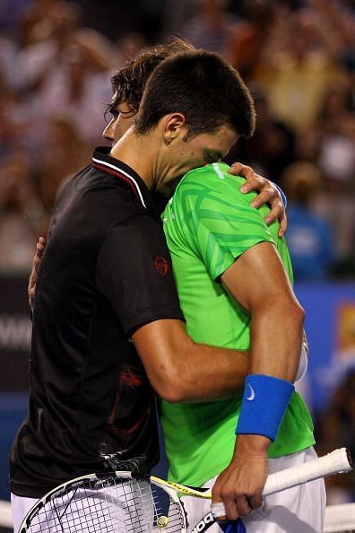 Nadal & Djokovic embrace after their titanic battle at AO 2012.