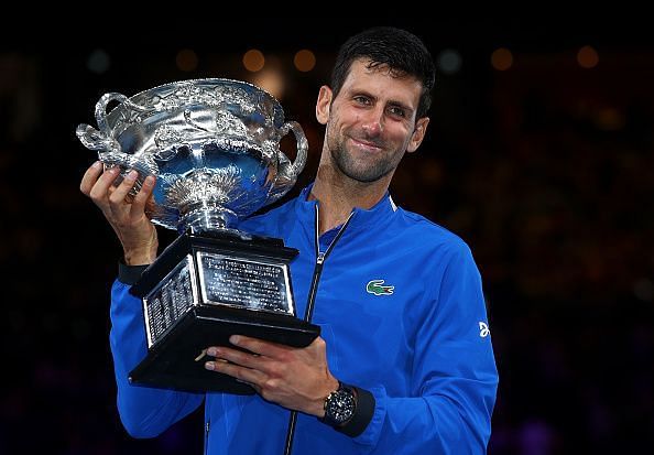 Novak Djokovic lifts the Norman Brookes Trophy for a record 7th time