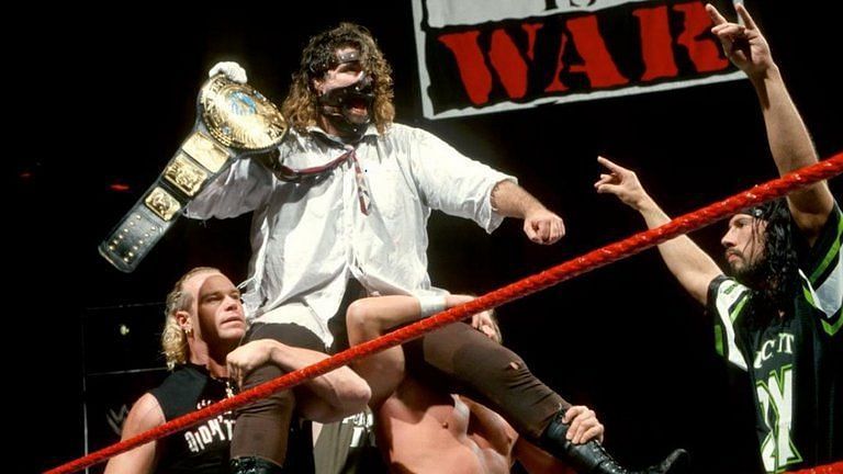 Mick Foley (Mankind) celebrates his first WWE Championship victory over The Rock at 