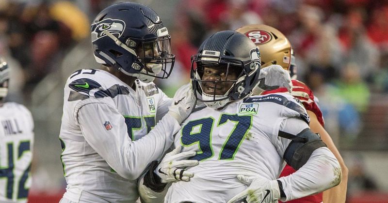 Poona Ford (right) in action for the Seattle Seahawks [Image: Seattle Times]