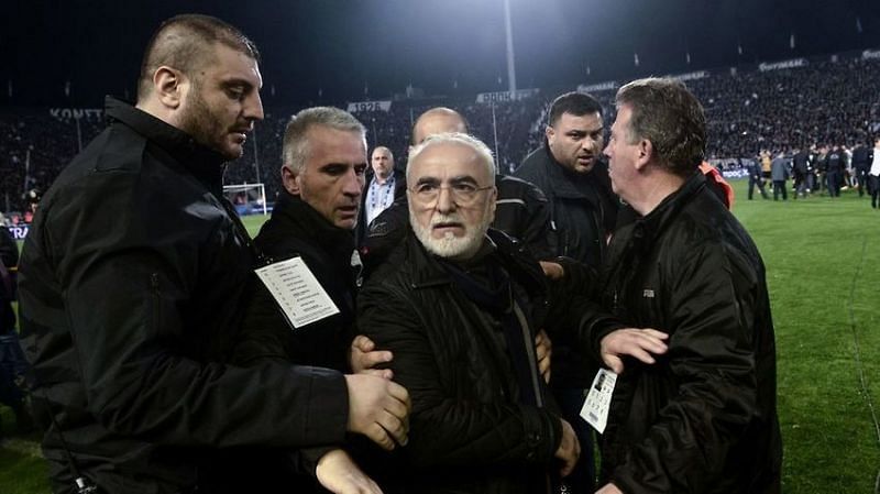 PAOK owner Ivan Savvidis being escorted off the field