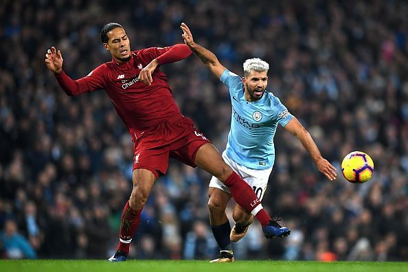 Van Dijk tussles with Aguero for the ball