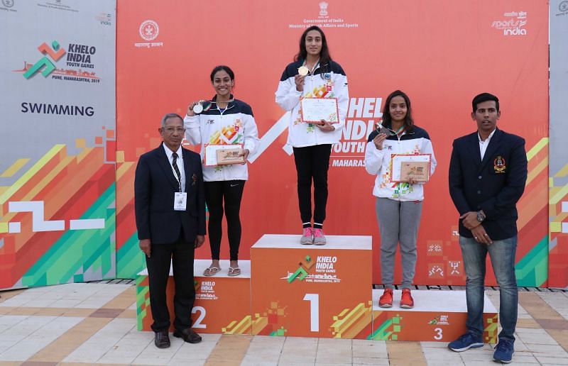 Gujarat&#039;s Maana Patel (in middle) with her 50m backstroke gold medal 