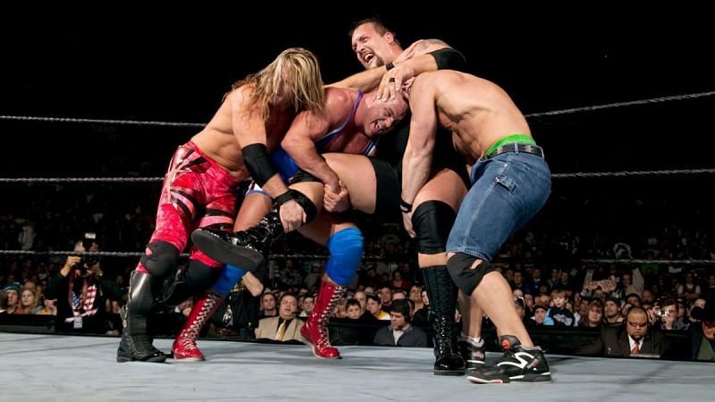 Chris Jericho, Kurt Angle, and John Cena all trying to eliminate the Big Show during the 2004 Royal Rumble