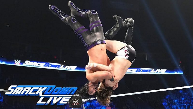 Mustafa Ali delivering a Spanish Fly to Daniel Bryan