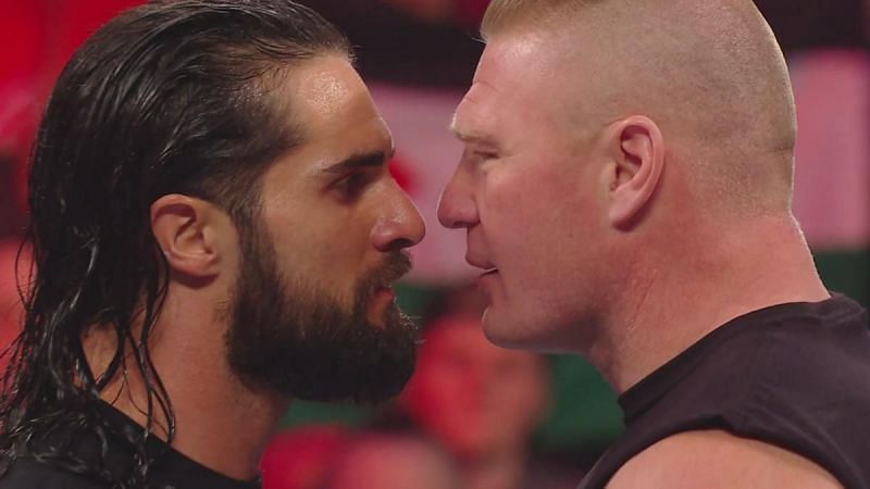 Brock Lesnar and Seth Rollins staring each other.