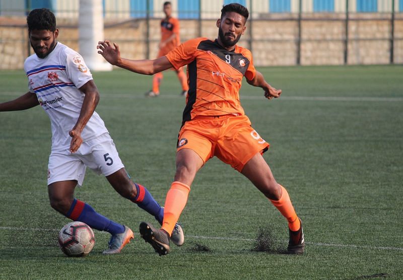 Cletus Paul of South United FC battles for the ball