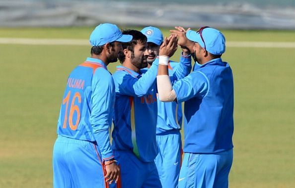 Parvez Rasool is being congratulated by his teammates