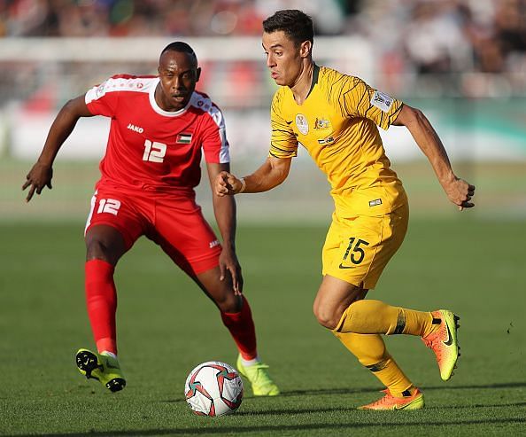 Palestine's Khaled Salem in the red jersey would look to score against Jordan