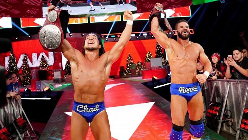 Roode and Gable are shown celebrating with the Raw Tag Team titles. (Source - WWE)
