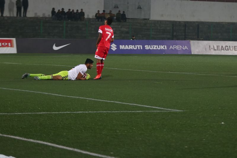 Shillong Lajong&#039;s Sheen Sokhtung looks on as Real Kashmir&#039;s Bilal Khan holds on to the ball before him