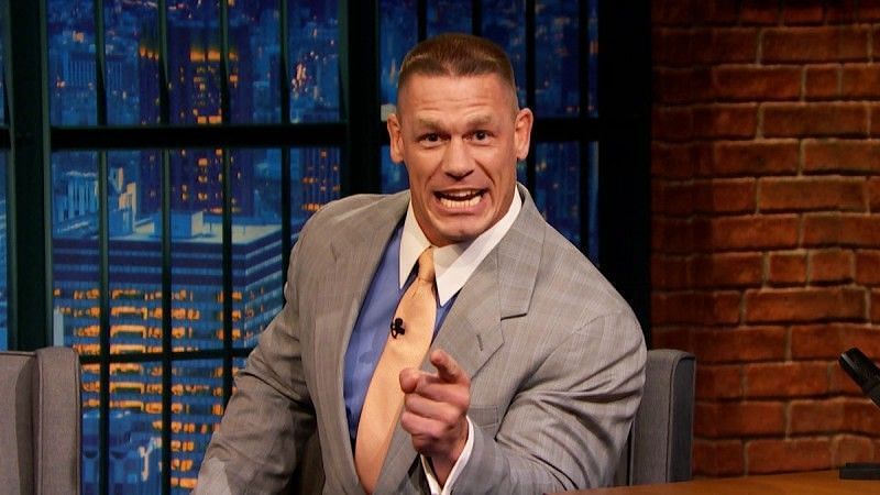 Cena is shown doing media work with the NBC