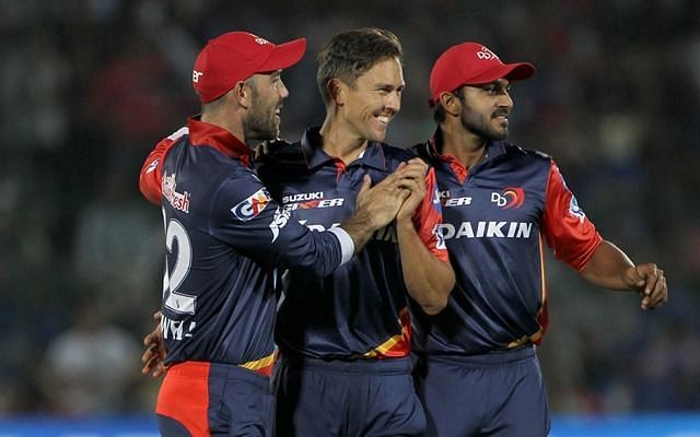 Trent Boult (middle) celebrates with his teammates