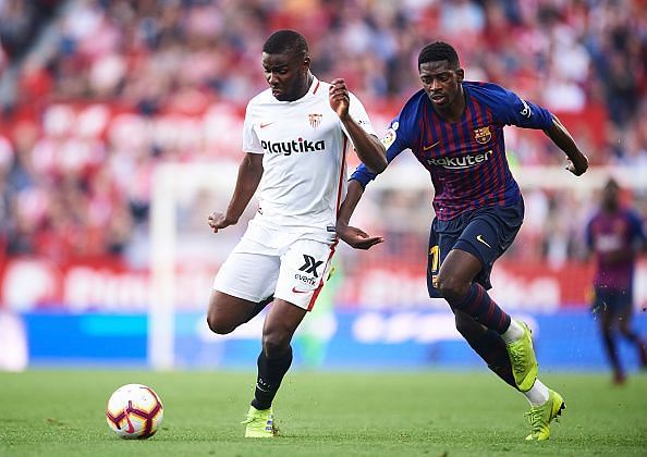 Ibrahim Amadou and Ousmane Dembele in action