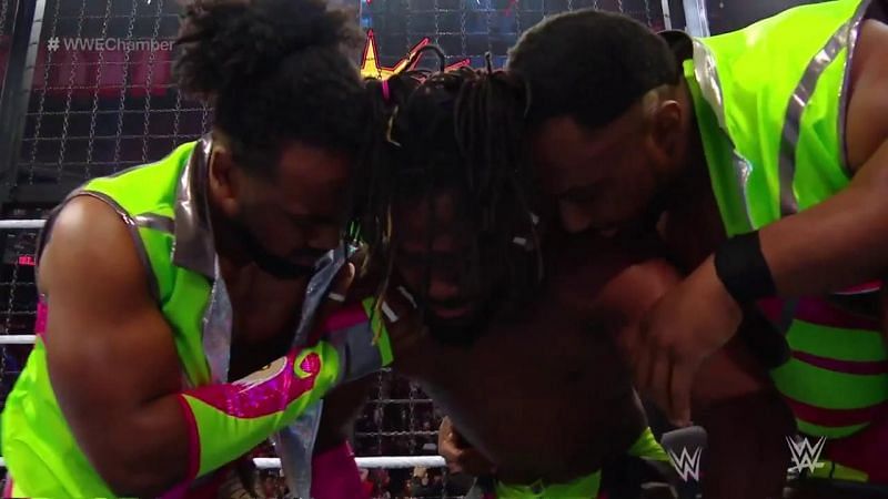 Xavier Woods and Big E helping Kofi Kingston after his great showing