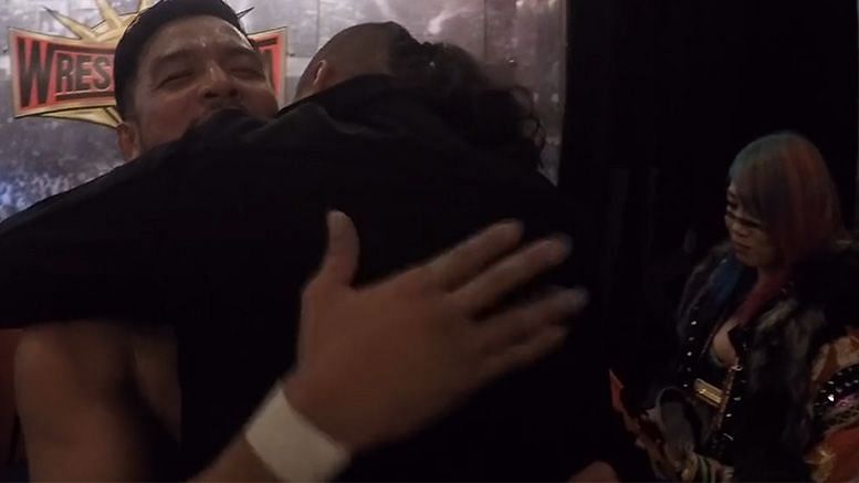 Itami and Nakamura sharing a touching moment backstage.