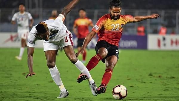 East Bengal&#039;s Jobby Justin vies for possession with Eze Kingsley of Mohun Bagan